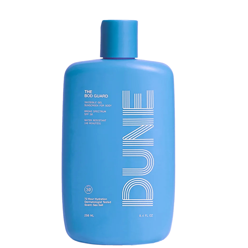 A blue bottle of sunscreen lotion labeled 'DUNE THE BOD GUARD' with text indicating SPF 30 and other product details.
