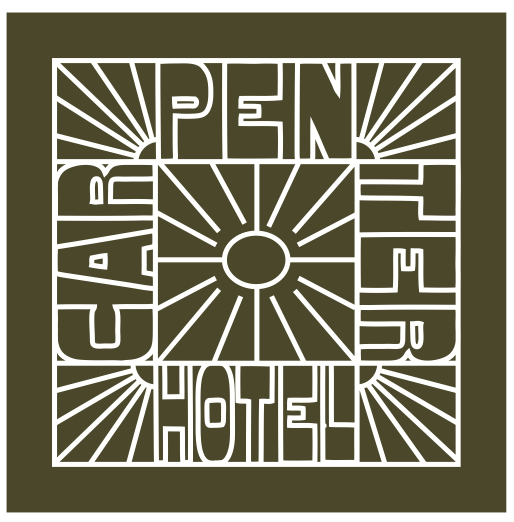 A olive green bandana with white text and graphic design resembling a sunburst pattern.