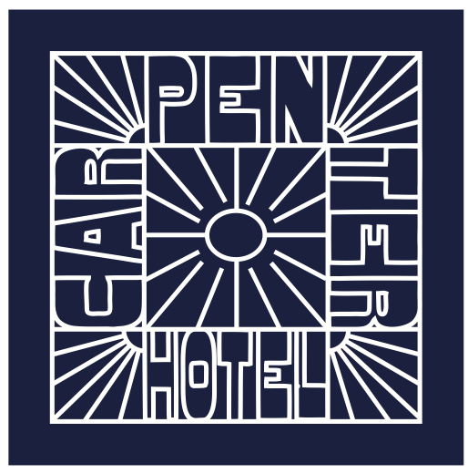 A navy blue bandana with white text and graphic design resembling a sunburst pattern.