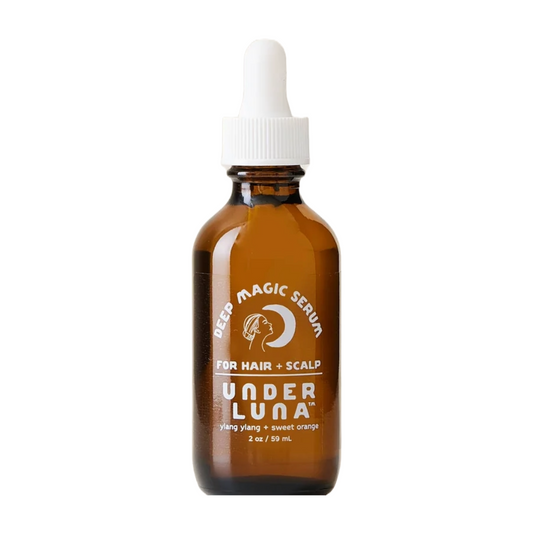 A bottle of Under Luna Deep Magic Hair & Scalp Serum with a dropper, labeled for hair and scalp treatment.