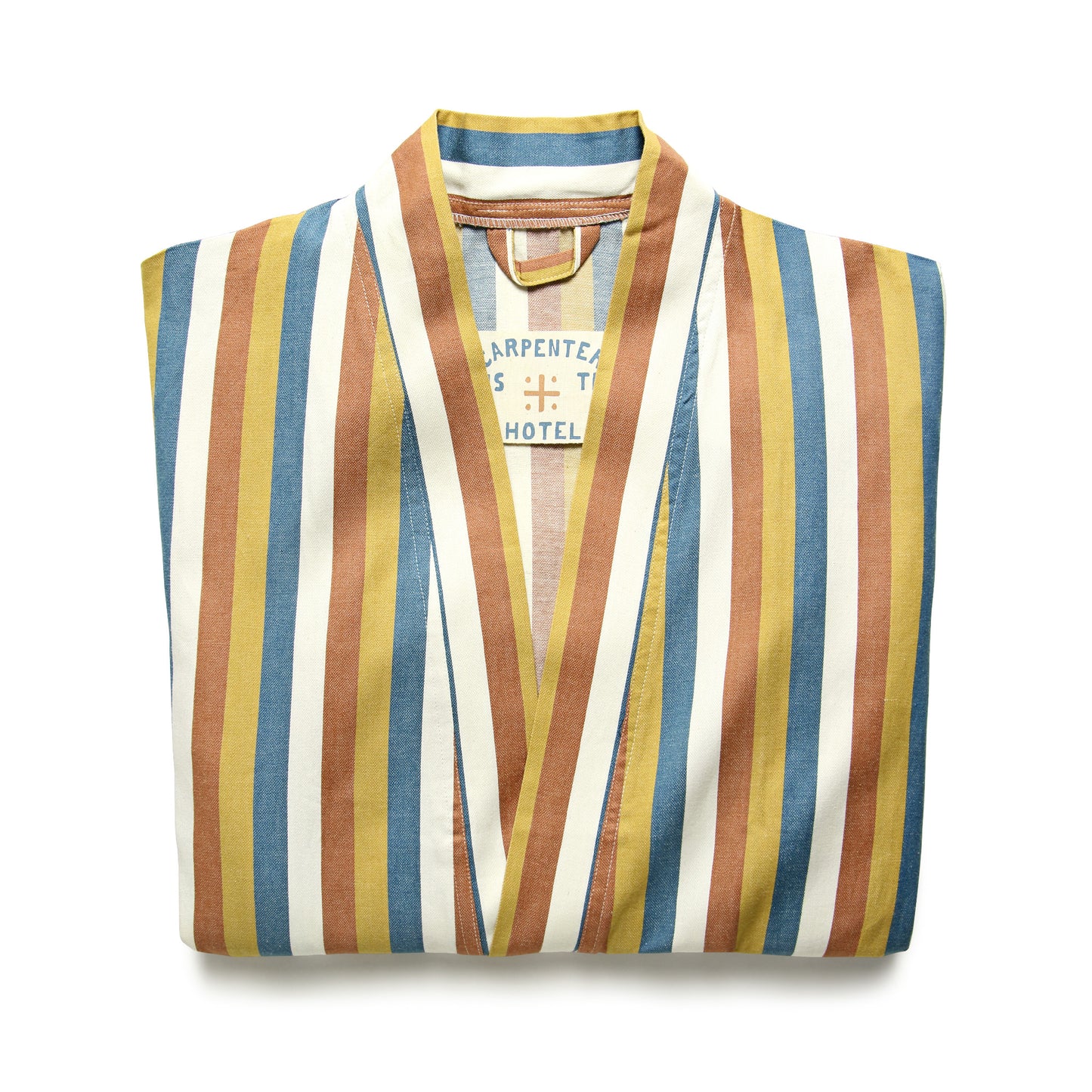 A folded multicolored striped robe with a label showing 'Carpenter Hotel'.