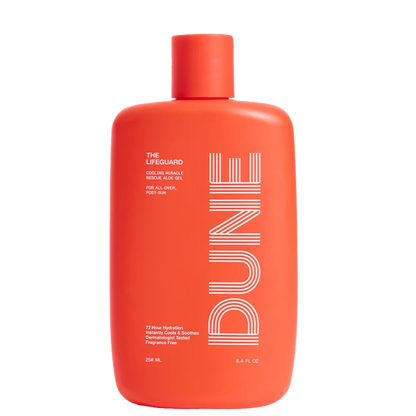 A red bottle of Dune Suncare The Lifeguard aloe gel with white and silver text detailing the product name and benefits.