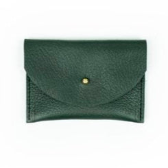 Pebbled leather kelp green cardholder with golden colored brass hardware on white background