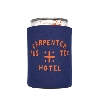 A blue neoprene koozie with orange text 'CARPENTER AUS TEX HOTEL' printed on it, displaying a beverage can.